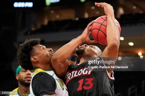 Isaiah Briscoe of the Trilogy attempts a shot while being guarded by Leandro Barbosa of the Ball Hogs during BIG3 - Week Five at the Fiserv Forum on...