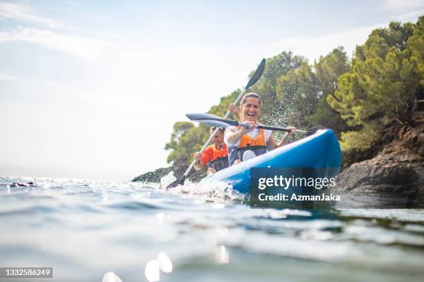 energetic spanish kayakers approaching camera - active lifestyles stock pictures, royalty-free photos & images