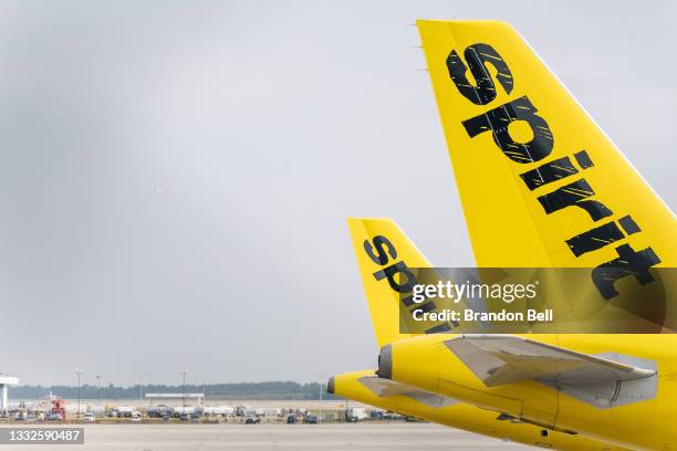 Spirit Airlines aircrafts are shown at the George Bush Intercontinental Airport on August 05, 2021 in Houston, Texas. Spirit and American Airlines...