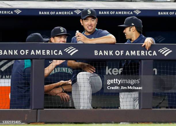 Yusei Kikuchi of the Seattle Mariners smiles from the dugout in the fifth inning against the New York Yankees at Yankee Stadium on August 05, 2021 in...