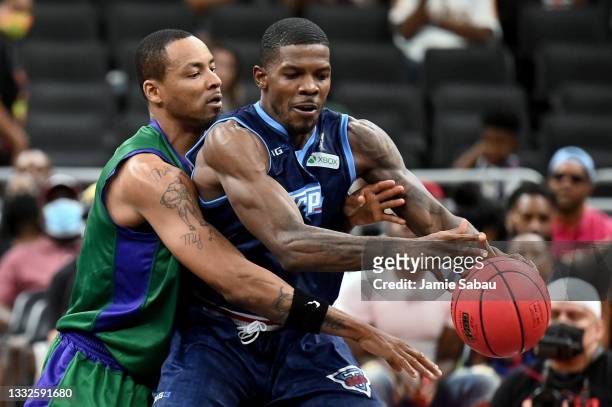 Joe Johnson of the Triplets dribbles the ball while being guarded by Rashard Lewis of the 3 Headed Monsters during BIG3 - Week Five at the Fiserv...