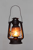 old rusty kerosene black lamp isoleted on gray background