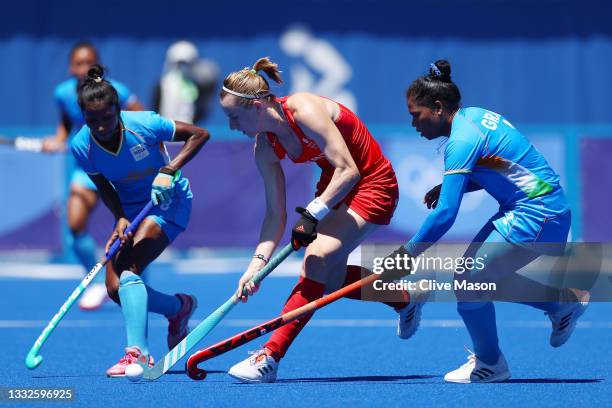 Elena Sian Rayer of Team Great Britain and Deep Grace Ekka of Team India battle for a loose ball during the Women's Bronze medal match between Great...