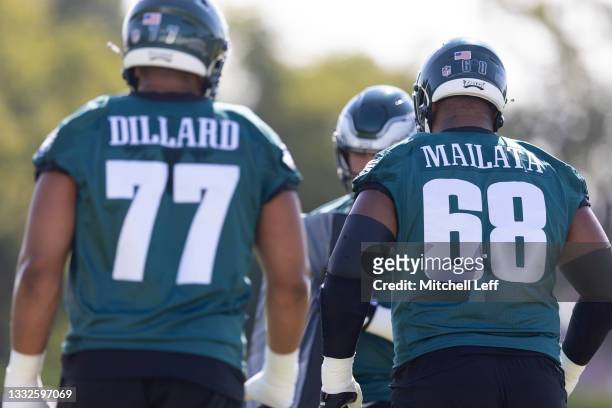 Andre Dillard and Jordan Mailata of the Philadelphia Eagles look on during training camp at the NovaCare Complex on August 5, 2021 in Philadelphia,...