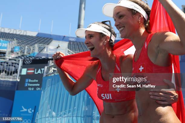 Joana Heidrich and Anouk Verge-Depre of Team Switzerland celebrate after defeating Team Latvia during the Women's Bronze Medal Match on day fourteen...