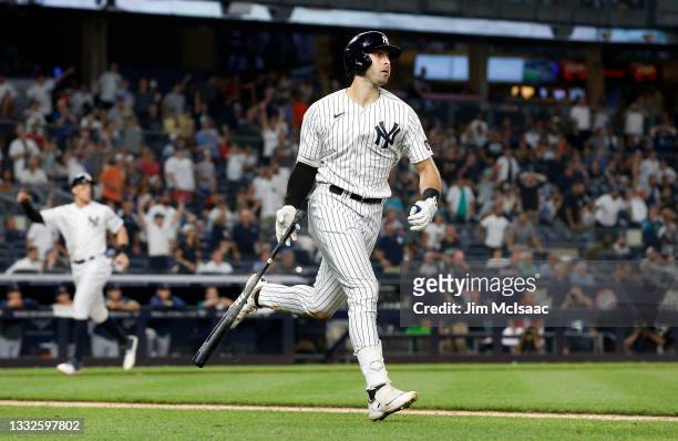 Joey Gallo of the New York Yankees watches the flight of his seventh inning three run home run against the Seattle Mariners at Yankee Stadium on...
