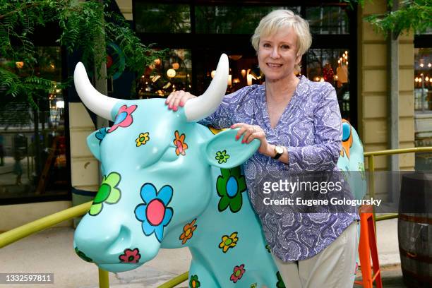 Artist Eve Plumb poses with her "Daisy" painted cow on display at the CowParade 2021 launch event hosted by God’s Love We Deliver at the Artist...
