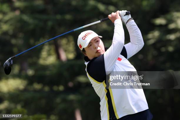 Shanshan Feng of Team China plays her shot from the 12th tee during the third round of the Women's Individual Stroke Play on day fourteen of the...