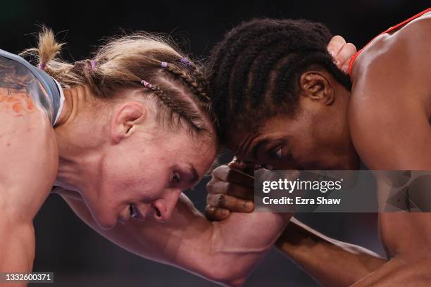 Joseph Emilienne Essombe Tiako of Team Cameroon competes against Roksana Marta Zasina of Team Poland during the Women's Freestyle 53kg Repechage on...