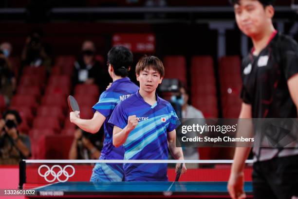 Mizutani Jun and Koki Niwa of Team Japan in action during their Men's Team Bronze Medal table tennis match on day fourteen of the Tokyo 2020 Olympic...