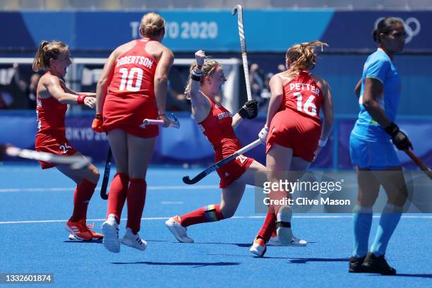 Hollie Pearne-Webb of Team Great Britain celebrates scoring their third goal with Shona McCallin, Sarah Robertson and Isabelle Petter during the...