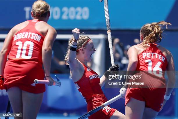 Hollie Pearne-Webb of Team Great Britain celebrates scoring their third goal with Sarah Robertson and Isabelle Petter during the Women's Bronze medal...