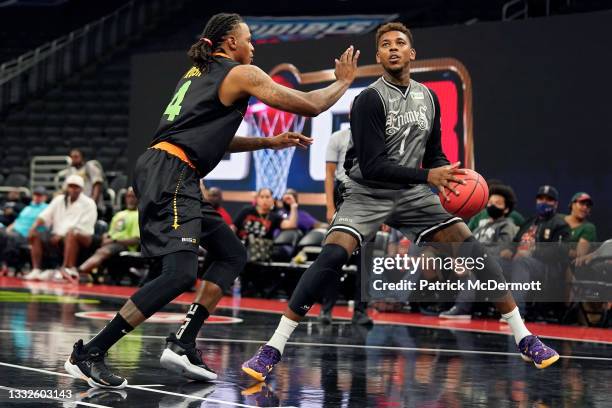 Nick Young of the Enemies dribbles the ball while being guarded by Brandon Rush of the Aliens during BIG3 - Week Five at the Fiserv Forum on August...