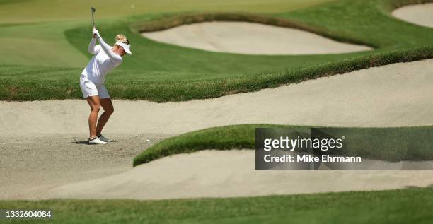 Nanna Koerstz Madsen of Team Denmark plays a shot from a bunker on the 11th hole during the third round of the Women's Individual Stroke Play on day...