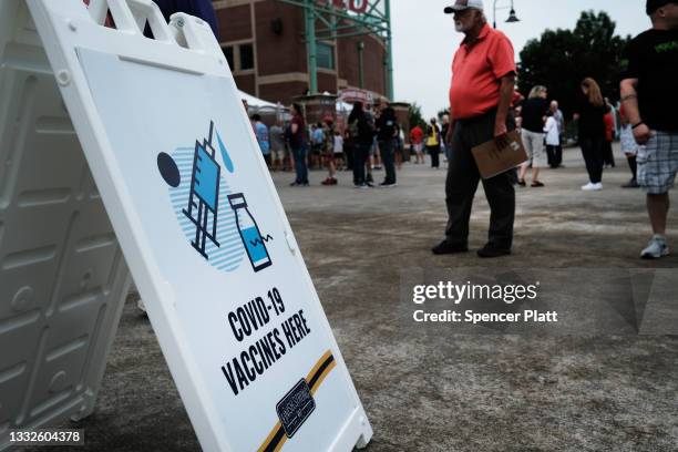 People wait to get vaccinated for Covid-19 at a baseball game on August 05, 2021 in Springfield, Missouri. According to the latest numbers from the...