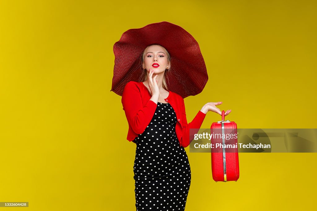 Fashionable woman in black polka dot dress