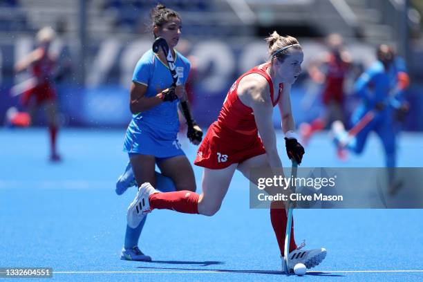 Elena Sian Rayer of Team Great Britain moves the ball past Udita of Team India during the Women's Bronze medal match between Great Britain and India...