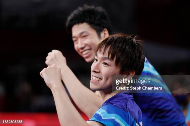 Koki Niwa and Mizutani Jun of Team Japan react during their Men's Team Bronze Medal table tennis match on day fourteen of the Tokyo 2020 Olympic...