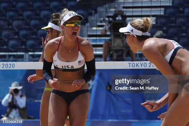 April Ross and Alix Klineman of Team United States celebrate while competing against Team Australia during the Women's Gold Medal Match on day...