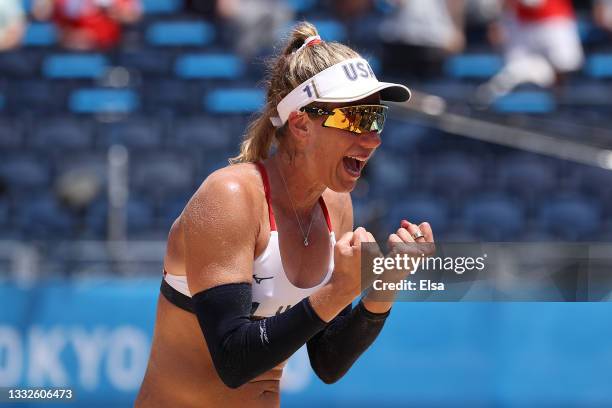 April Ross of Team United States celebrates after defeating Team Australia during the Women's Gold Medal Match on day fourteen of the Tokyo 2020...