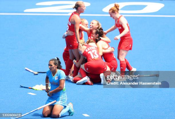 Rani of Team India looks on while Team Great Britain celebrates winning the Women's Bronze medal match between Great Britain and India on day...