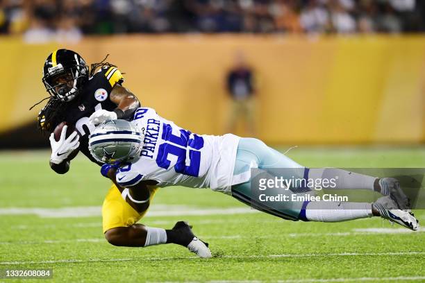 Anthony McFarland of the Pittsburgh Steelers is tackled by Steven Parker of the Dallas Cowboys in the second half during the 2021 NFL preseason Hall...