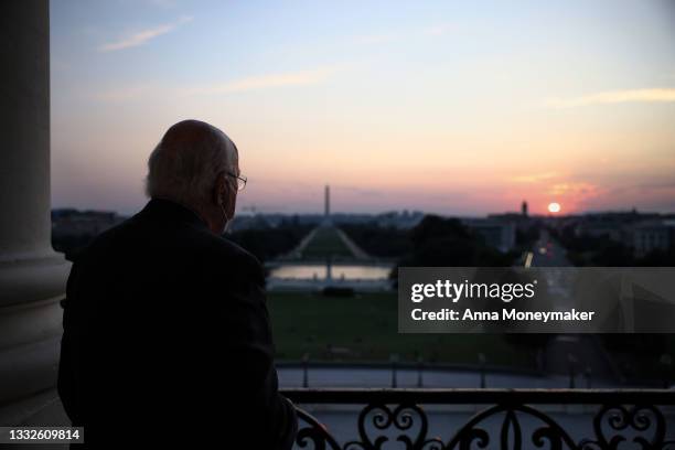 Sen. Pat Leahy takes photos of the sunset from the Speakers Balcony at the U.S. Capitol Building during a pause in votes on August 05, 2021 in...