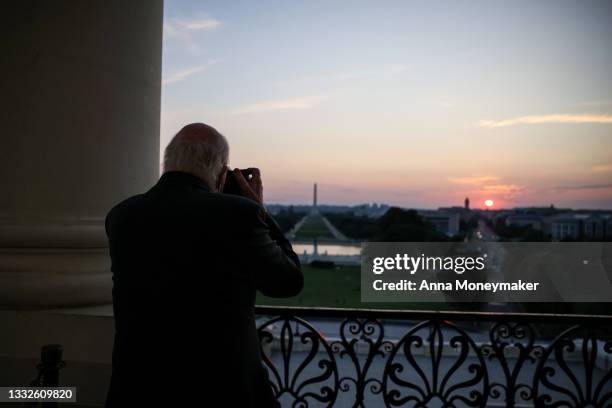 Sen. Pat Leahy takes photos of the sunset from the Speakers Balcony at the U.S. Capitol Building during a pause in votes on August 05, 2021 in...