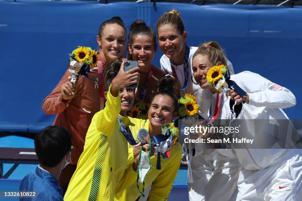 Silver medalists Mariafe Artacho del Solar and Taliqua Clancy of Team Australia, gold medalists April Ross and Alix Klineman of Team United States...