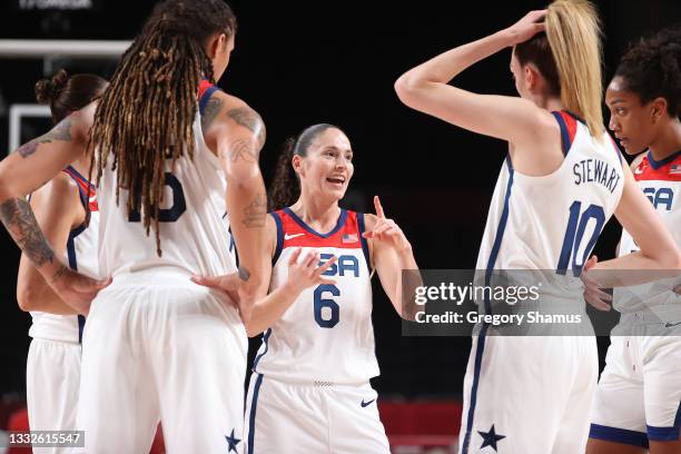 Sue Bird of Team United States talks strategy with teammates during the first half of a Women's Basketball Semifinals game between Team United States...