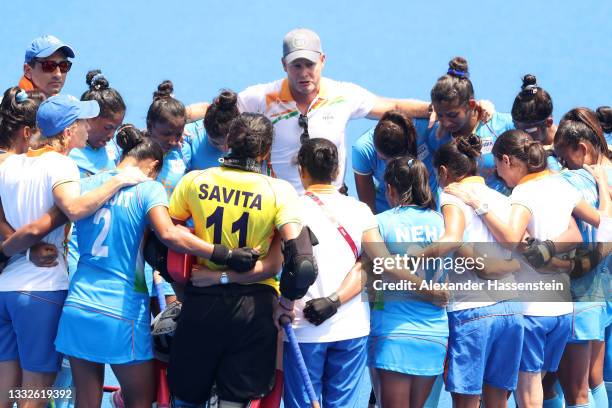 Team India huddles up following their loss in the Women's Bronze medal match between Great Britain and India on day fourteen of the Tokyo 2020...