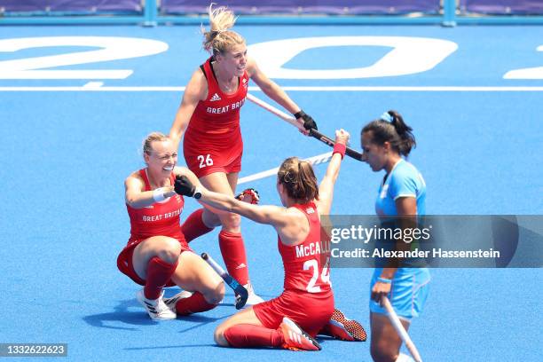 Hannah Martin, Shona McCallin and Lily Owsley of Team Great Britain celebrate after winning the Women's Bronze medal match between Great Britain and...