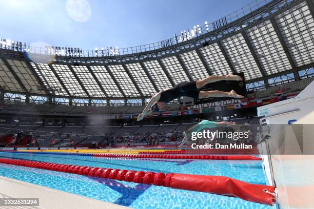 Volha Silkina of Team Belarus and other competitors dive at the start of the 200 metre freestyle swimming heat of the Women's Modern Pentathlon on...