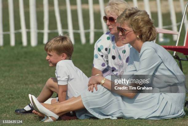 British Royal Diana, Princess of Wales , wearing a pale blue Catherine Walker dress, with her son Prince William and her mother Frances Shand Kydd...