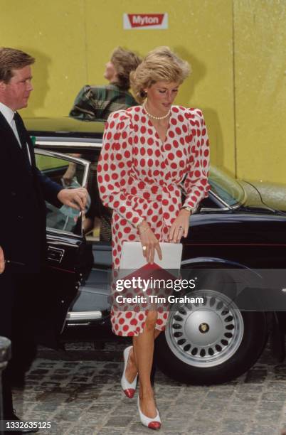 British Royal Diana, Princess of Wales , wearing a white-and-red polka dot Catherine Walker dress, during a visit to the Royal College of Art in...