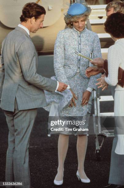 British Royals Charles, Prince of Wales and his wife, Diana, Princess of Wales , wearing a blue-and-pink floral pattern Miss Antoinette suit and a...