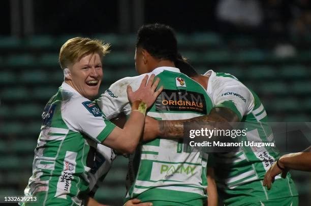 Brett Cameron of Manawatū on debut celebrates with team mates after scoring a try during the round one Bunnings NPC match between Manawatu and...