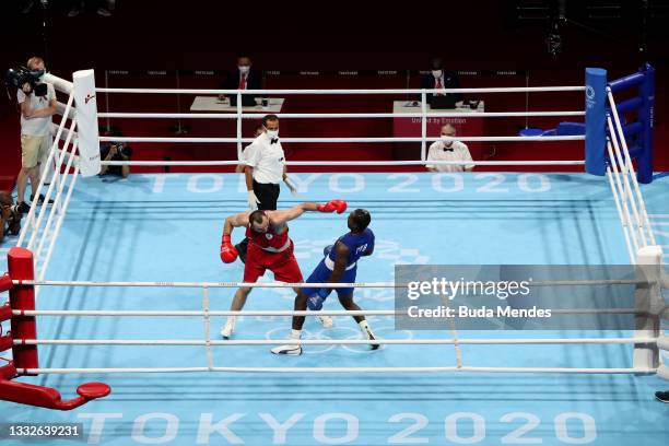 Muslim Gadzhimagomedov of Team ROC exchanges punches with Julio La Cruz of Team Cuba during the Men's Heavy Final Bout on day fourteen of the Tokyo...