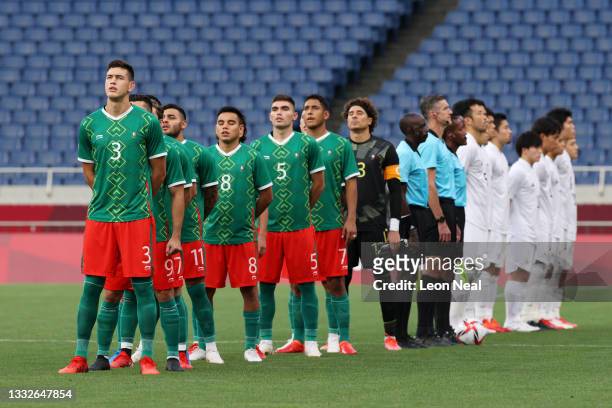 Cesar Montes of Team Mexico stands for the national anthem with his team mates prior to the Men's Bronze Medal Match between Mexico and Japan on day...