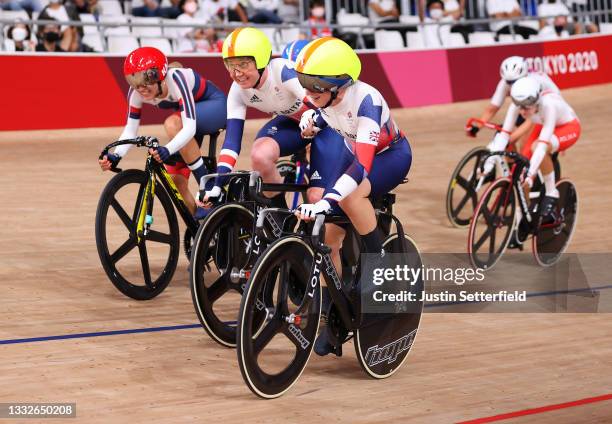 Katie Archibald and Laura Kenny of Team Great Britain celebrate winning a gold medal during the Women's Madison final of the track cycling on day...