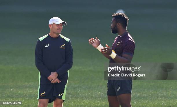 Siya Kolisi, the South Africa captain, talks to head coach Jacques Nienaber during the South Africa Springboks captain's run at Cape Town Stadium on...