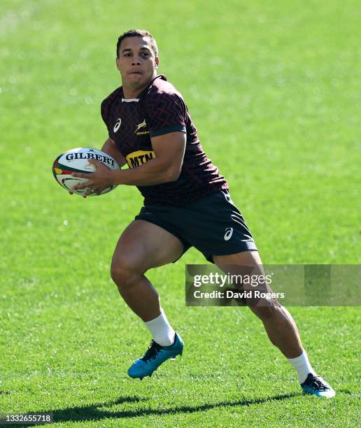 Cheslin Kolbe runs with the ball during the South Africa Springboks captain's run at Cape Town Stadium on August 06, 2021 in Cape Town, South Africa.