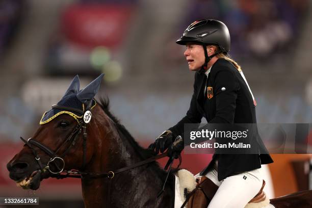 Annika Schleu of Team Germany looks dejected following her run in the Riding Show Jumping of the Women's Modern Pentathlon on day fourteen of the...