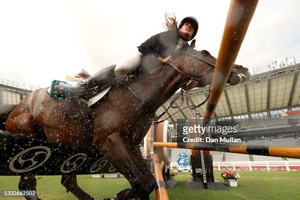 Ieda Guimaraes of Team Brazil riding Caleansiena YH falls at a jump in the Riding Show Jumping of the Women's Modern Pentathlon on day fourteen of...