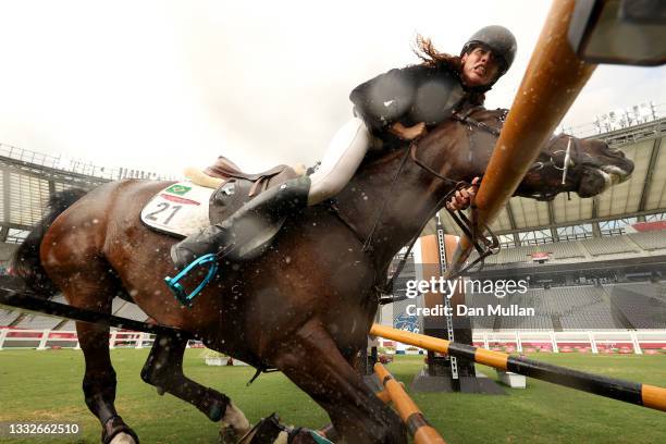 Ieda Guimaraes of Team Brazil riding Caleansiena YH falls at a jump in the Riding Show Jumping of the Women's Modern Pentathlon on day fourteen of...