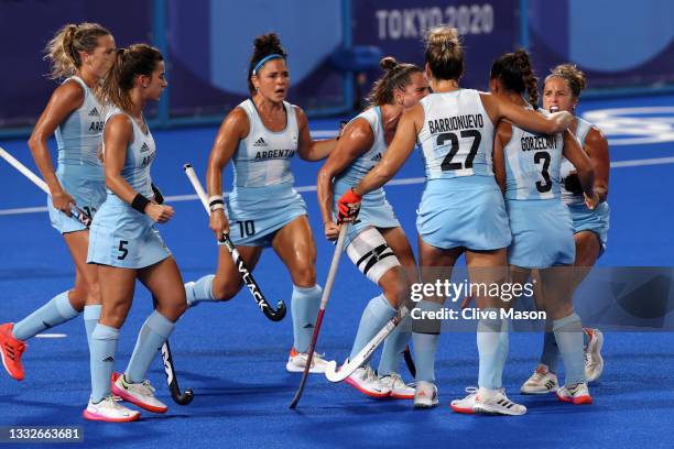 Agustina Gorzelany of Team Argentina celebrates with teammates after scoring their team's first goal during the Women's Gold Medal match between...