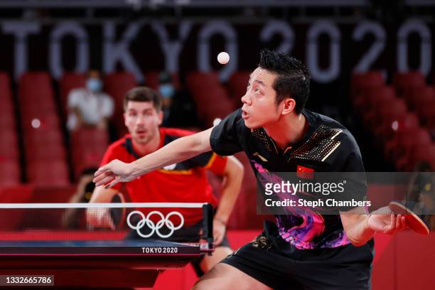 Xu Xin of Team China serves the ball during his Men's Team Gold Medal table tennis match on day fourteen of the Tokyo 2020 Olympic Games at Tokyo...