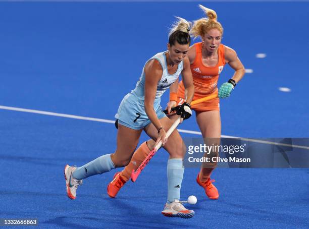 Agustina Albertarrio of Team Argentina and Margot van Geffen of Team Netherlands battle for the ball during the Women's Gold Medal match between...