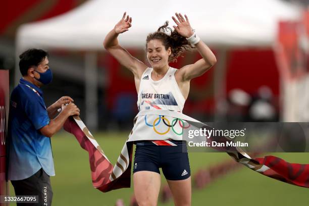 Kate French of Team Great Britain crosses the line to win gold in the Laser Run during the Women's Modern Pentathlon on day fourteen of the Tokyo...