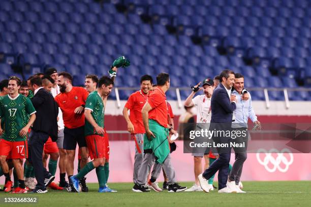 Jaime Lozano, Head Coach of Mexico is congratulated following victory in the Men's Bronze Medal Match between Mexico and Japan on day fourteen of the...